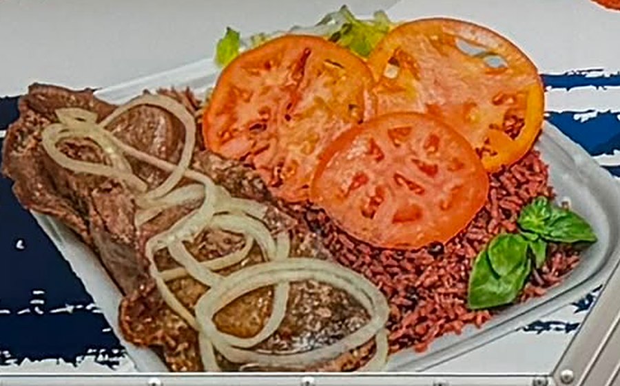 Palomilla steak with onions, rice and tomatoes